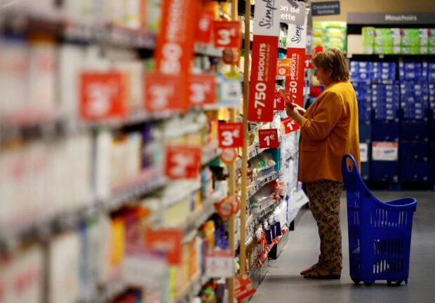 A woman shops at a Carrefour supermarket in Montessori near Paris