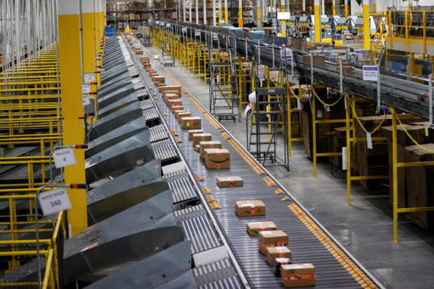 Conveyor moves packages to delivery trucks at Amazon's fulfillment center in New Jersey