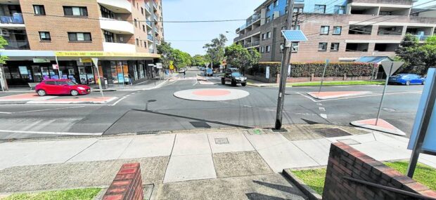 Mini roundabouts are round islands at intersections that serve to both reduce speeds and organize traffic. This is a typical roundabout in Sydney, Australia. (AMADO DE JESUS)