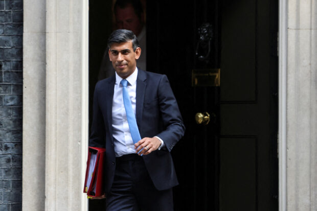 FILE PHOTO: British Prime Minister Rishi Sunak walks at Downing Street in London, Britain September 6, 2023. 