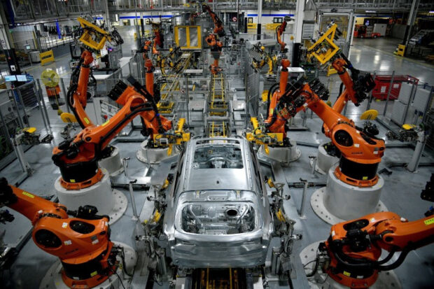 Robots assemble an X model SUV at the BMW facility in South Carolina