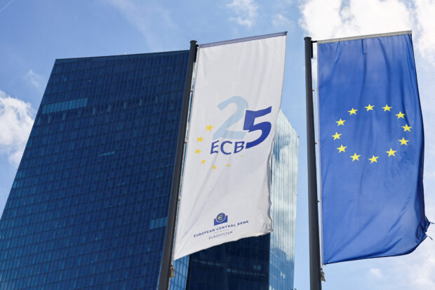 ECB and EU flags in front of the European Central Bank building in Frankfurt