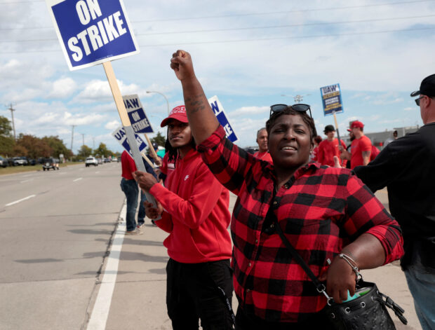 Striking UAW member Candis Holmes outside the Ford Michigan assembly plant