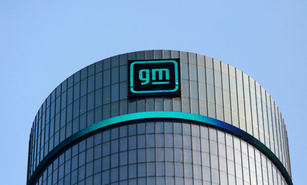 GM logo atop the company headquarters in Detroit