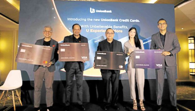 CREDIT LINE UnionBank executives led by (fromleft) AlbertCuadrante, chief marketing officer; Manoj Varma, consumer banking head; Edwin Bautista, president and CEO; Carissa Sindiong, cards products head; and Vishal Kadian, cards and loans head —CONTRIBUTED PHOTO