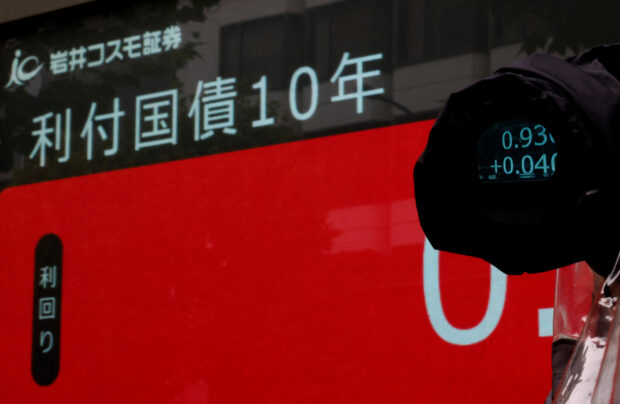 An electronic board outside a brokerage displaying Japan's 10-year gov't bonds level