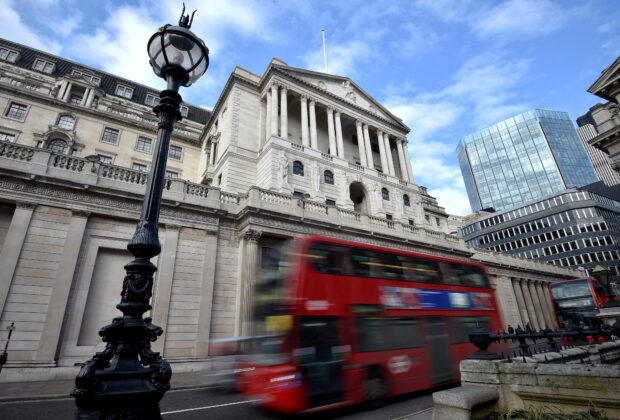 A bus passes the Bank of England in London