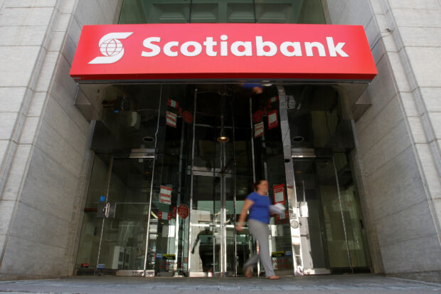 A woman leaving a Bank of Nova Scotia branch in Ottawa