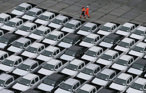 Chinese cars unloaded from a ship at a commercial port in Vladivostok, Russia