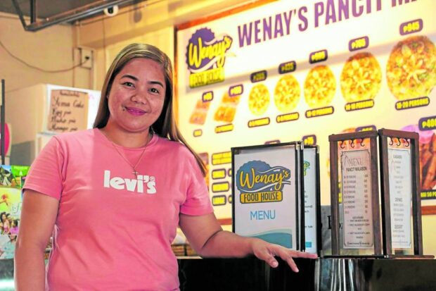 SHE’S THE BOSS Rowena Ermino of Sorsogon runs a “pasalubong”store and food house that employs more than 20 people. —PHOTOS FROM STANDARD CHARTERED BANK