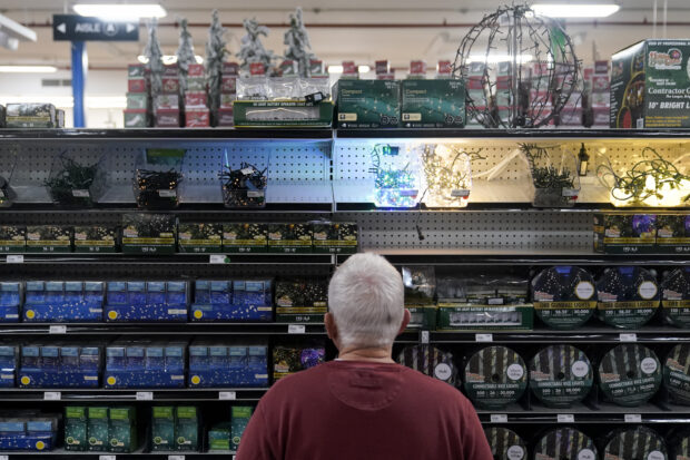 A customer browsing the holiday lights section at Blackhawk Hardware