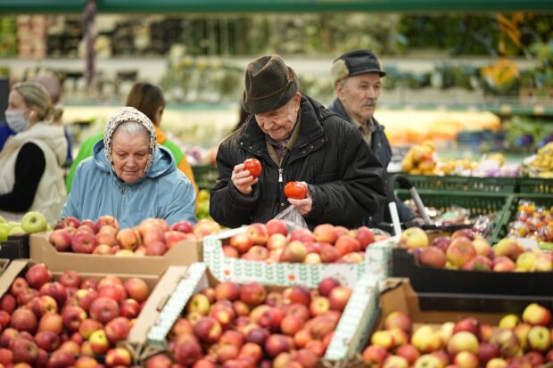People buy fruits at a hypermarket in Moscow
