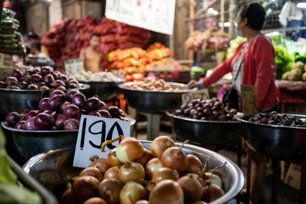 Onions are displayed at a stall in a public market in Manila 