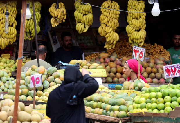 A woman shops at a market in Cairo, Egypt