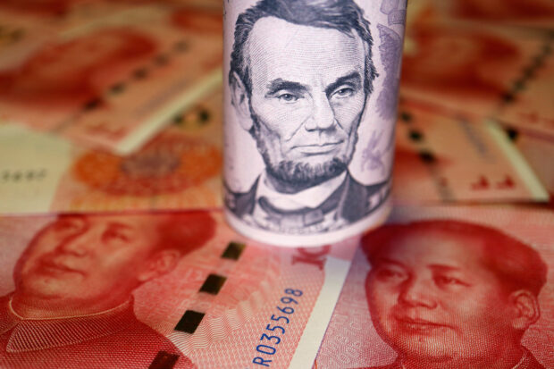 A dollar note on yuan banknotes