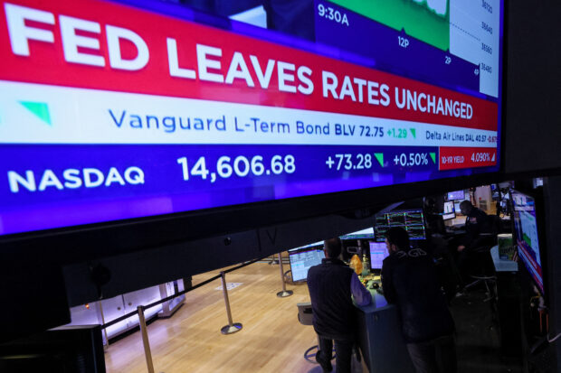 Dow at record highs as Fed signals rate cuts in 2024