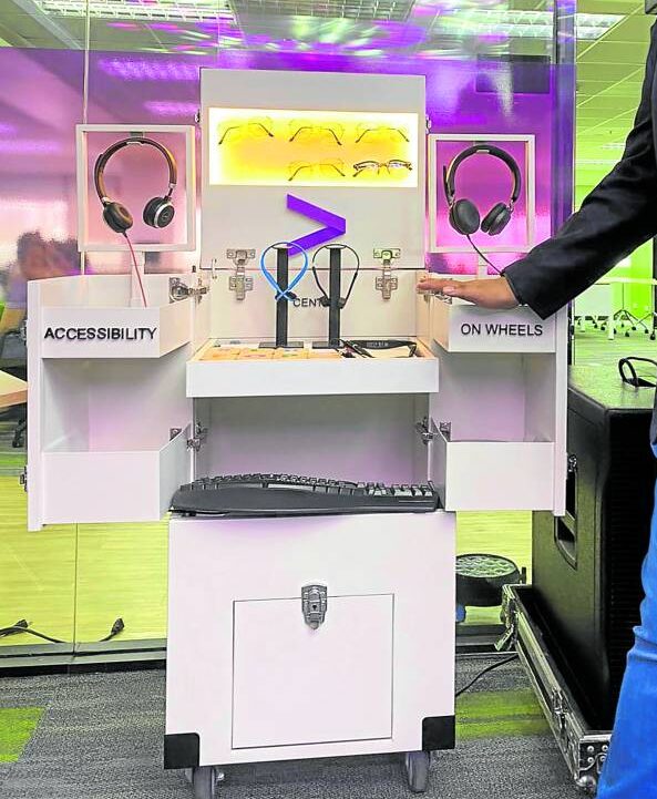 PWD TECH Accenture officials showcase tools to assistPWDs, including headsets, talk-to-text keyboards and glasses