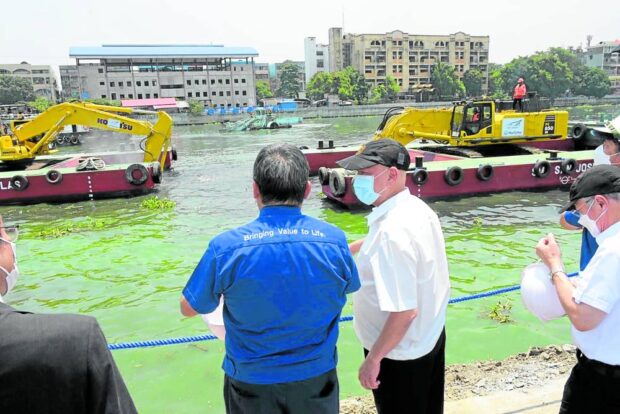 FLOOD MANAGEMENT Ang observes the dredging of Pasig River as part of SMC’s P3-billion river cleanup initiative to address heavy siltation and pollution