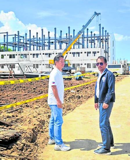 DHSUD Secretary Jose Rizalino Acuzar and Bacolod City Mayor Albee Benitez in November inspect the ongoing construction of the Yuhum Residences in Barangay Vista Alegre.