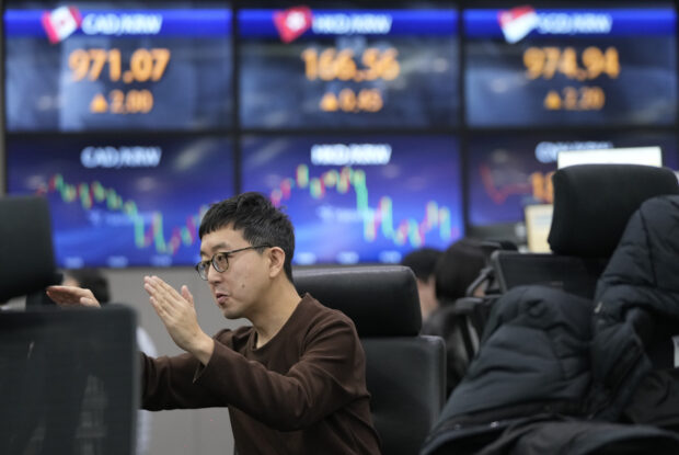 World shares mostly lower