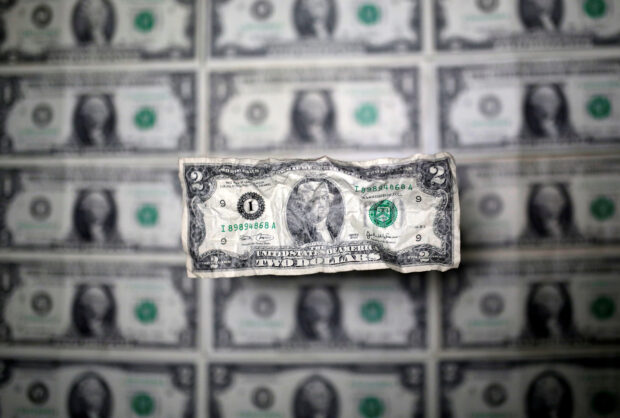 Dollar edges higher as risk rally hits pause