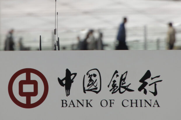 China's top banks tighten exposure to smaller peers, sources say