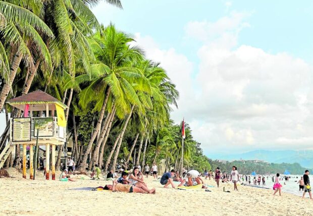 Tourists enjoying Boracay sun, sand and sea in this October 2023 photo. 