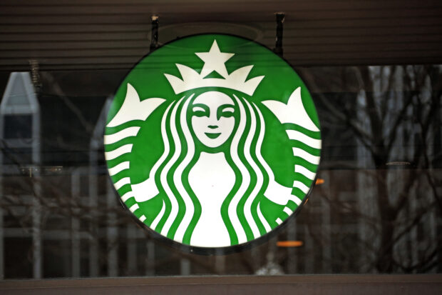 Starbucks reports record Q1 revenue but lowers outlook as consumer spending falls in some markets