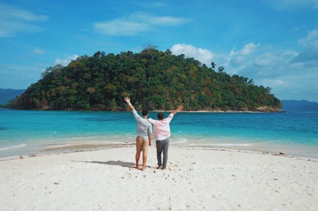“The Poor Traveler” creators basking in the sun, sand and sea at Port Barton in Palawan in this 2018 photo.