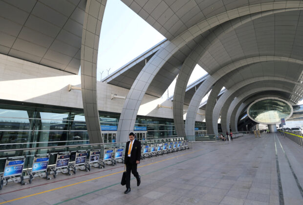 FILE PHOTO: A passenger is seen at the departure terminal three of Dubai Airports in Dubai