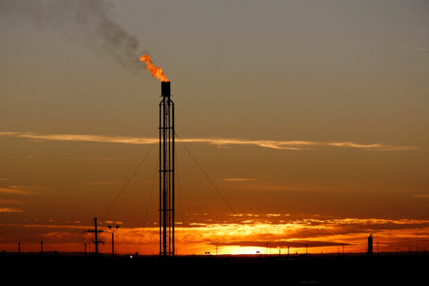 A flare burns excess natural gas in the Permian Basin in Loving County, Texas, U.S. 