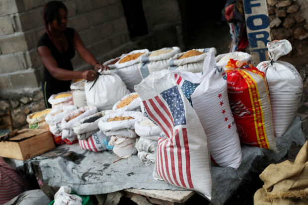 A local sells rice and grains at a street market in Port-au-Prince