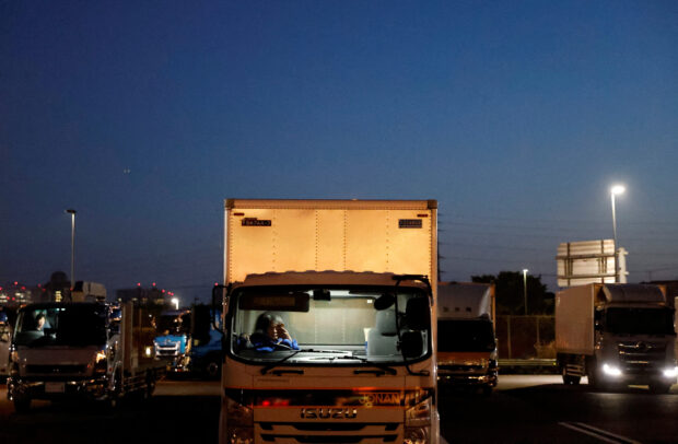 Japan's overworked, underpaid truckers left behind in wage bonanza