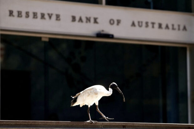 Australia's central bank holds rates, waters down tightening bias