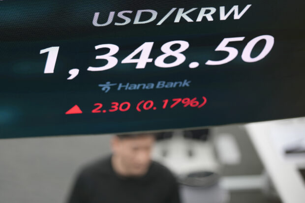 Asian shares mostly higher after another set of Wall St records