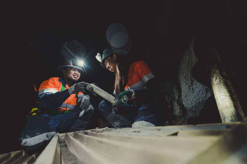 GeoTechnical personnelinspecting underground samples at Didipio mine.