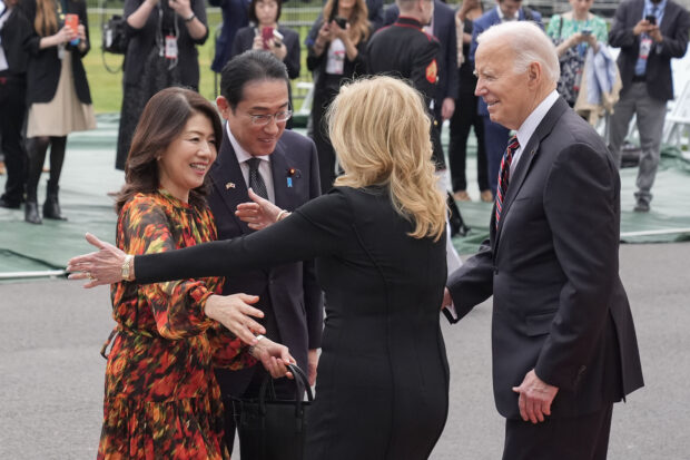 President Joe Biden, far right, and first lady Jill Biden greeting Japanese Prime Minister Fumio Kishida, second from the left, and his wife Yuko Kishida, far left, 