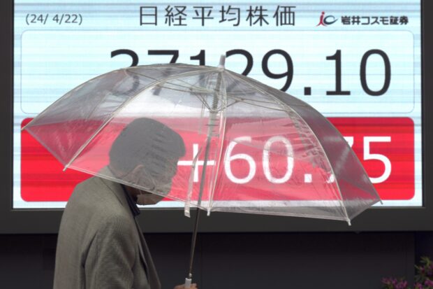 Asian shares shrug off Wall St blues as China leaves rate unchanged
