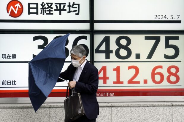 Asian shares mostly higher, though China benchmarks falter