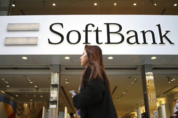 Japan's SoftBank Group trims investment losses 