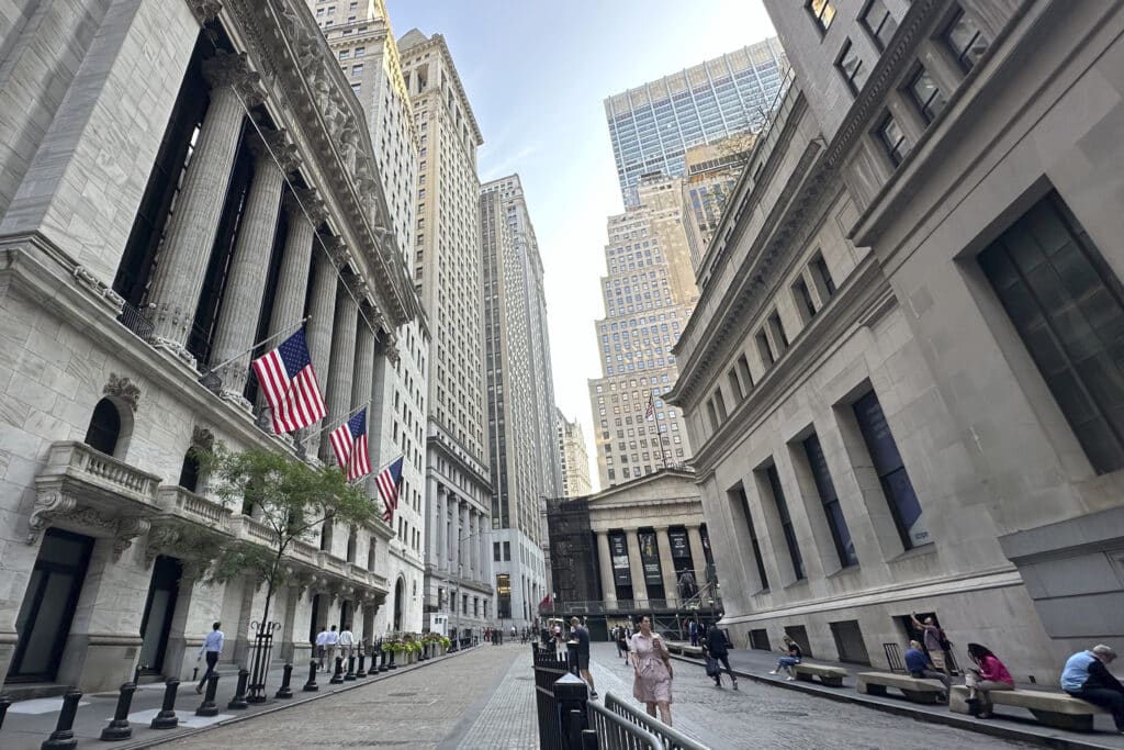The New York Stock Exchange, left, is shown on Wednesday, July 10, 2024, in New York. 