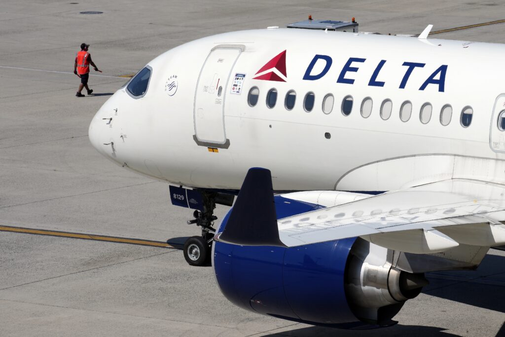 A Delta Air Lines jet leaves the gate, Friday, July 19, 2024, at Logan International Airport in Boston. 