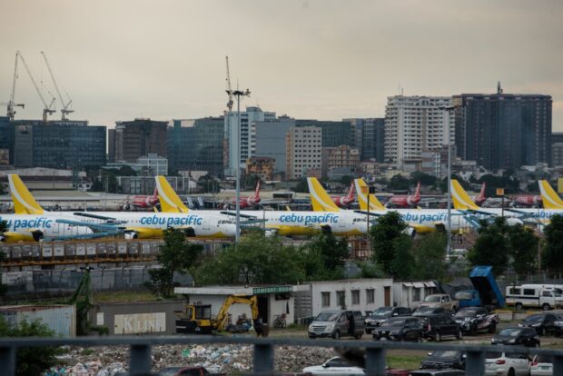 This picture shows Cebu Pacific planes parked at Ninoy Aquino International Airport in Pasay, Metro Manila on January 1, 2023. 