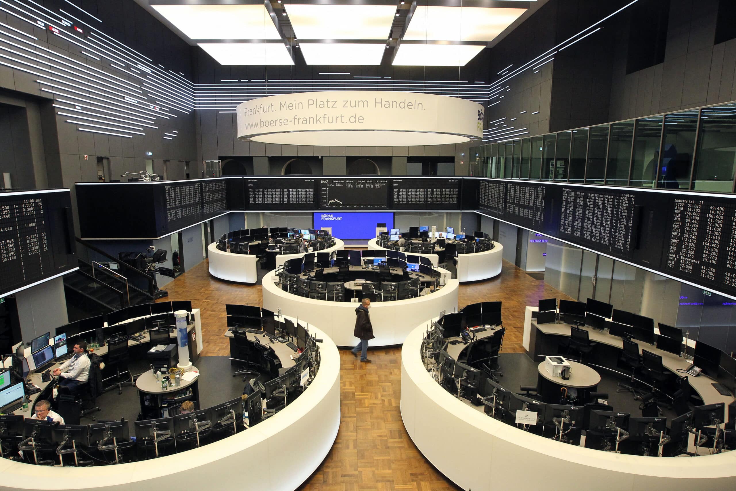 Traders works at the stock exchange in Frankfurt am Main, western Germany, on February 24, 2022. 