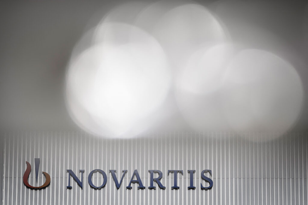 This photograph taken on October 30, 2022, shows the logo of the Swiss pharmaceutical and drug maker Novartis on a building in Basel