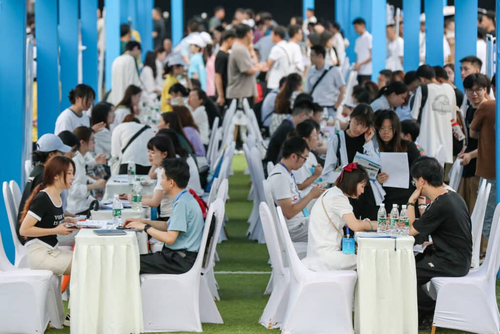 This photo taken on June 14, 2023 shows university graduates and youths attending a job fair in Yibin, in China's southwestern Sichuan province.