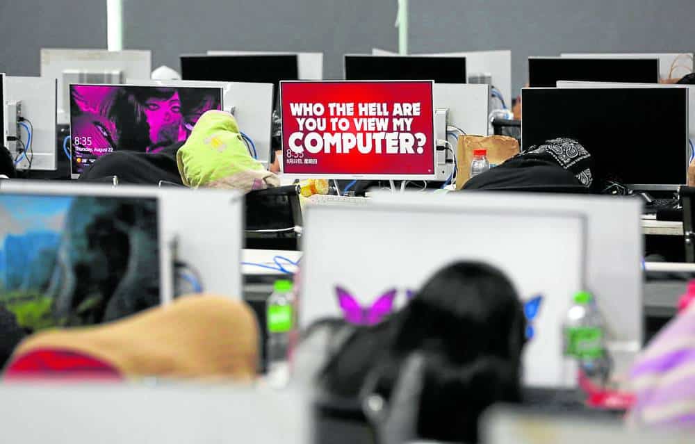 CRACKDOWN This suspected illegal Pogo hub on the ninth floor of The Centrium in Parañaque was raided by the police on Aug. 22. —NIñO JESUS ORBETA.