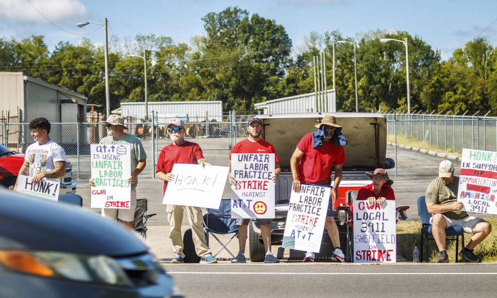 AT&T workers from the CWA Local 3911 picket outside an AT&T warehouse on Cox Boulevard in Sheffield, Ala., Monday, Aug. 19, 2024.