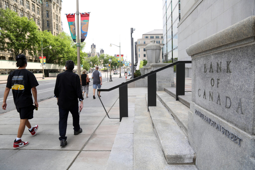 Pedestrians walk past the Bank of Canada in Ottawa, Ontario, Canada, on July 12, 2023.