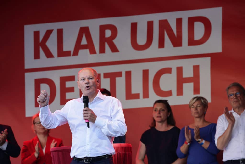 German Chancellor Olaf Scholz speaks on stage in Jena, eastern Germany on August 27, 2024